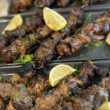 Four Skewers, Tabouli Salad, Chips, Tzatziki, Pita